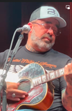 Aaron Lewis wearing Brothers & Arms USA In God We Trust graphic t-shirt